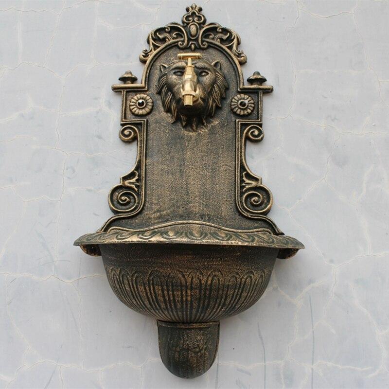 Fontaine murale tête de lion