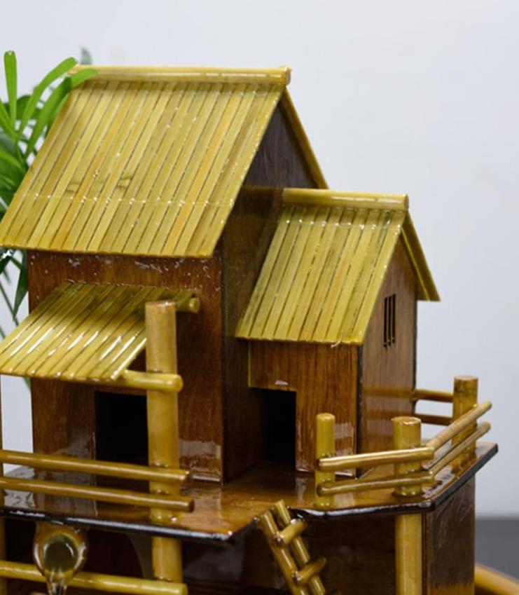 Fontaine en forme de maison en bambou